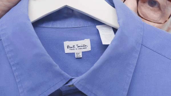 Paul Smith and a blue shirt in his hand, the colour template for his Paul Smith Edition model from 1998.